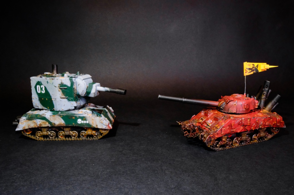 Two small miniature tanks for the game TONKS! One white and green, one red.